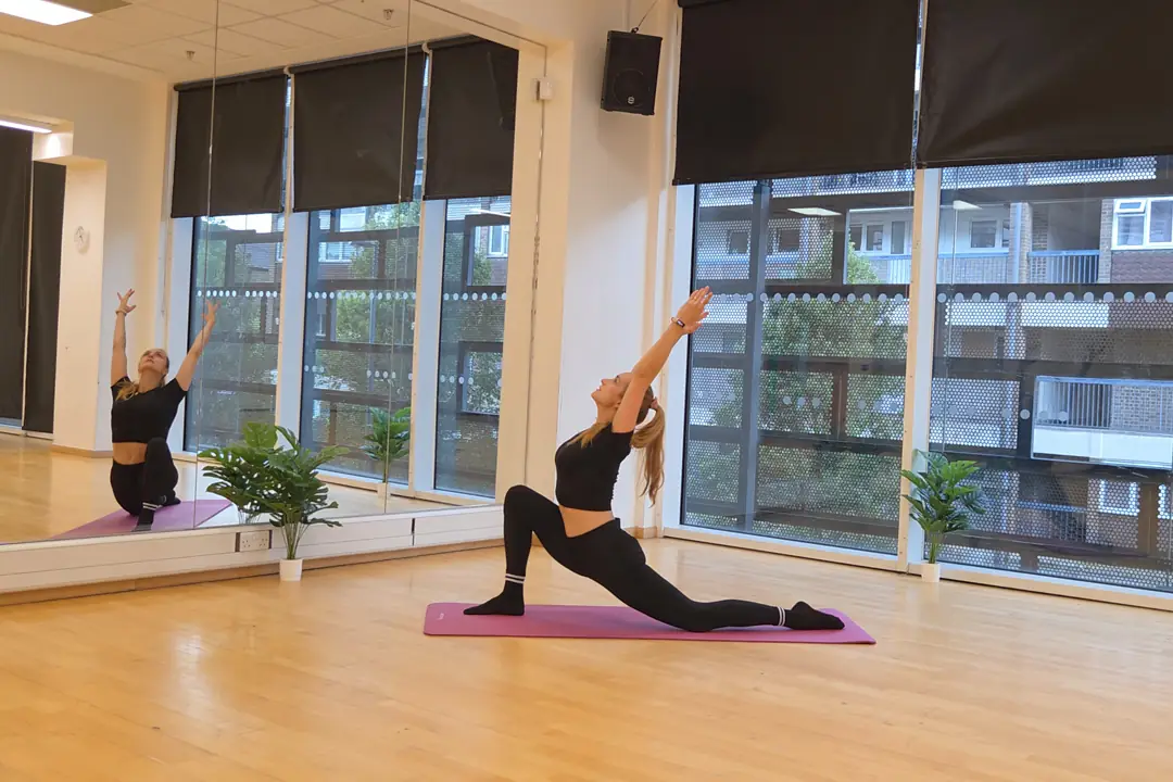 Pilates lunge stretch in studio